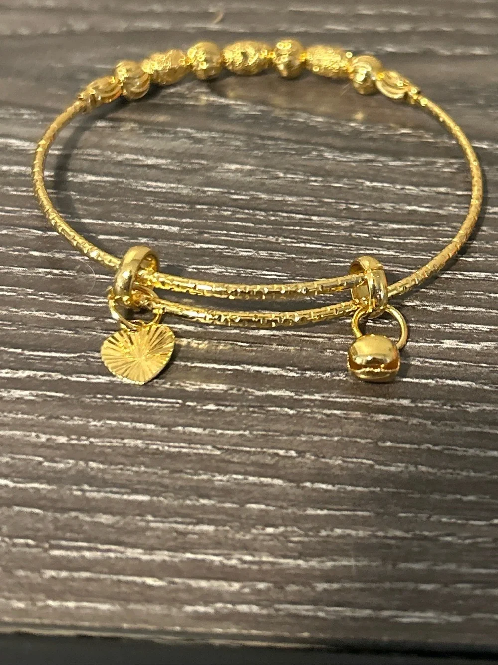 Golden tone beaded charm bracelet